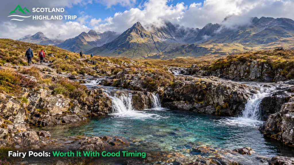 TikTok vs Reality: Are Viral Places in Scotland Worth Visiting? 2 Turquoise pools and small waterfalls of the Fairy Pools on the Isle of Skye beneath the jagged Black Cuillin mountains, with hikers on the path